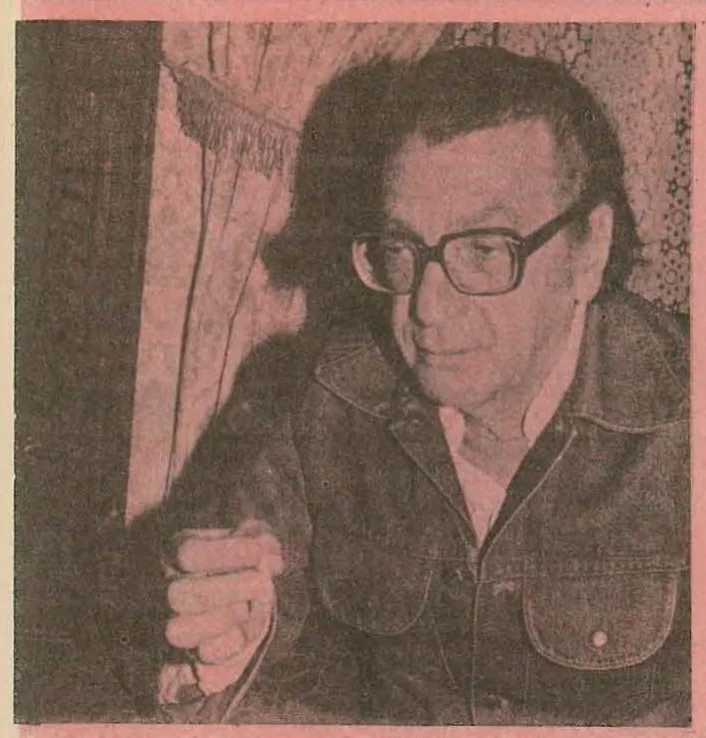 Portrait photograph of the author Vladimir Colin wearing glasses and a jacket, looking slightly downwards.