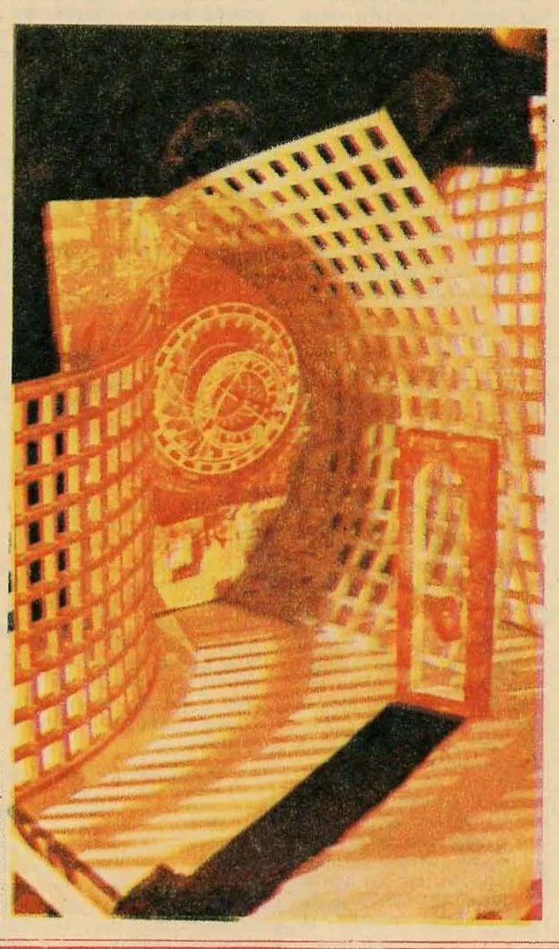 Illustration depicting a futuristic corridor or tunnel with grid-like walls and floor, bathed in warm orange/yellow light, with a circular mechanical element on the left wall.