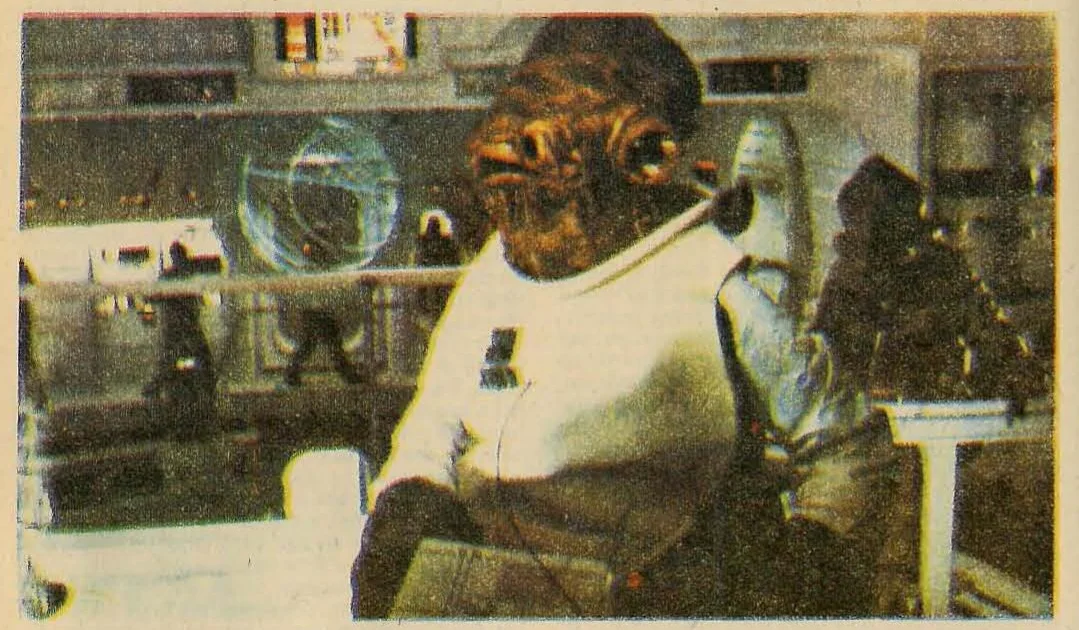 Illustration of a chimpanzee-like creature in a spacesuit or futuristic setting, looking intently at something glowing or a screen.