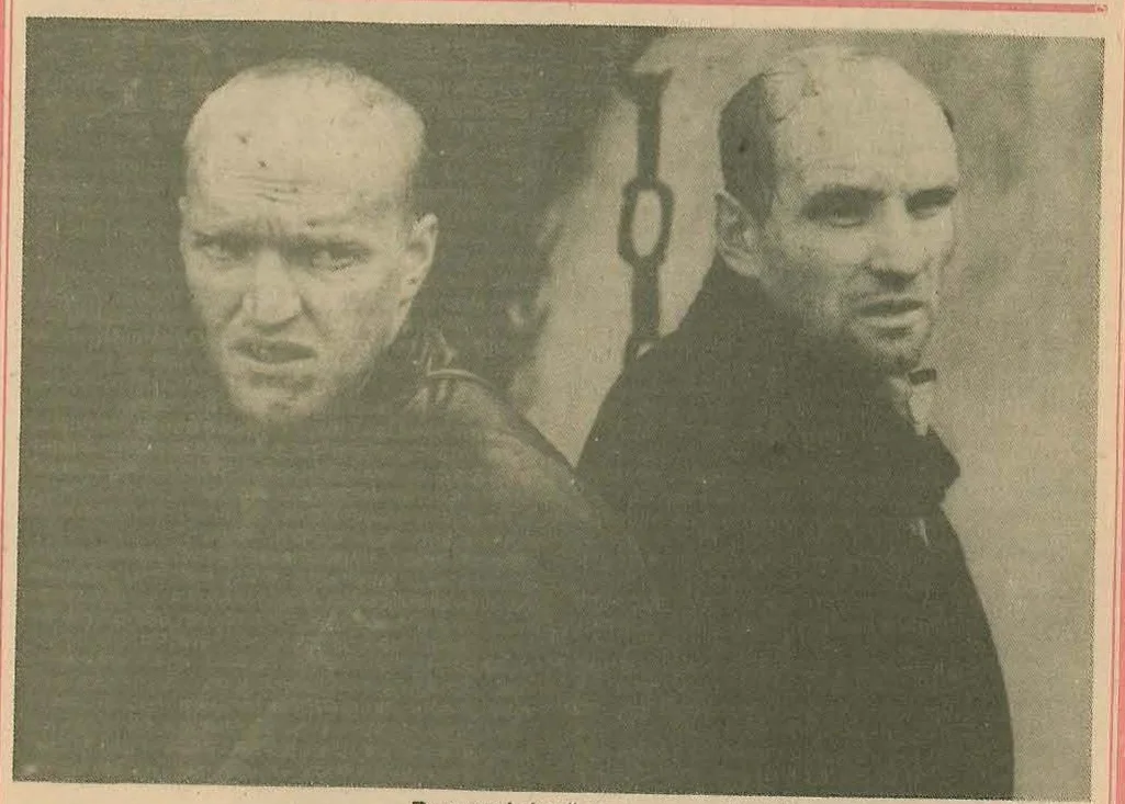 Black and white photograph of two men, likely a scene from the movie Stalker